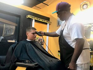 Iota Phi sponsors free haircut tour for students